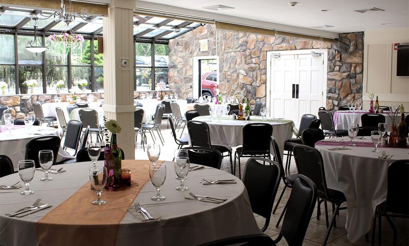 Atrium Room with focus on set table with seating for eight