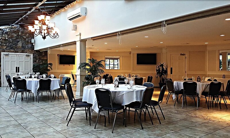 Atrium Room with multiple set tables